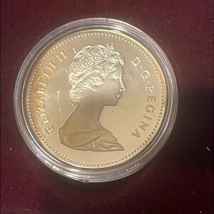 1982 Canadian Silver Dollar Coin with a Young Queen Elizabeth on the Front